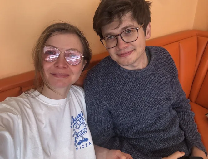 A selfie together in a pizza place